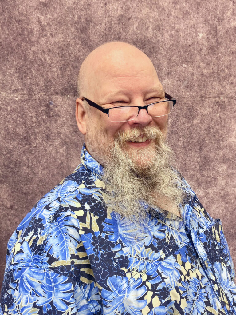 A picture of a man smiling.