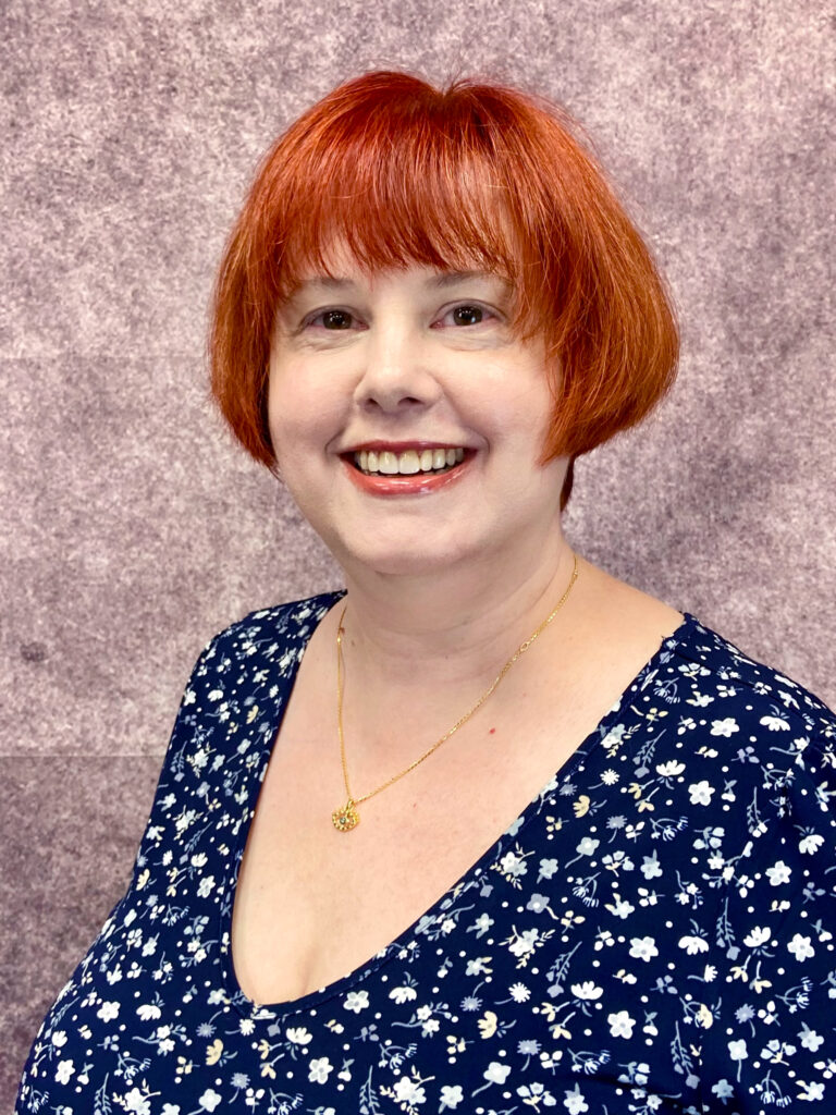 A picture of a woman smiling.