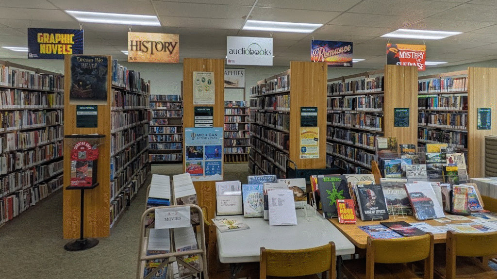 The shelves of the Baker Park library, with books on display
