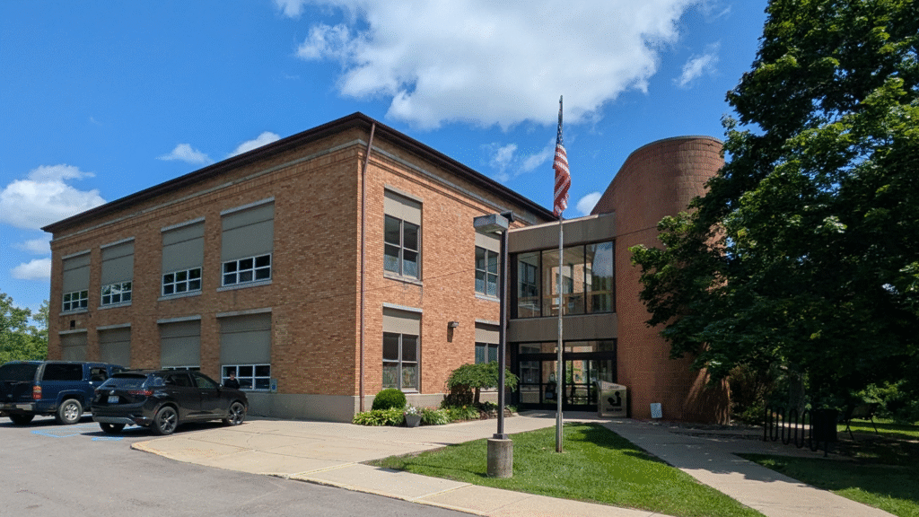 The Outside of the Clio Area Library, a two story building.