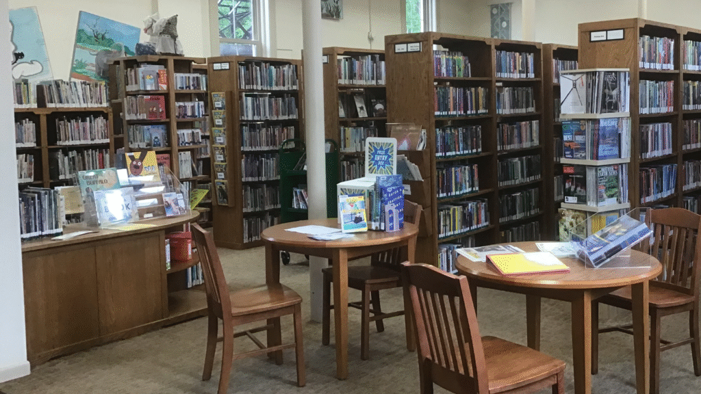 A picture of the Goodrich library, with tables and shelves of books.
